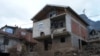 Nino Hindić in a house destroyed by a landslide, Donja Jablanica, Bosnia and Herzegovina