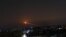 Missile fire is seen over the rebel-held city of Daraa in southwest Syria.