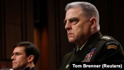 U.S. Chairman of the Joint Chiefs of Staff Gen. Mark A. Milley testifies beside U.S. Defense Secretary Mark Esper before a Senate Armed Services Committee hearing on "Department of Defense Budget Posture" on Capitol Hill in Washington, March 4, 2020