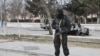 Kazakhstan - A Kazakh riot police officer patrols in center of Zhanaozen, Kazakhstan, Saturday, Dec. 17, 2011. Violent clashes broke out Friday between police and demonstrators in an oil town in western Kazakhstan. Authorities in Kazakhstan said Saturday 