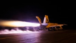 A US Navy handout photograph released on July 28 by US Central Command shows a Super Hornet fighter jet launching from the flight deck of the USS George HW Bush aircraft carrier, which is operating near the Persian Gulf. 