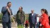 Armenia -- Mayor Gagik Beglarian, left, plants a tree in Yerevan on May 2, 2009.