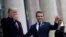 U.S. President Donald Trump and French President Emmanuel Macron gesture as they meet at Elysee presidential palace.