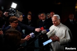 Pope Leo XIV speaks to reporters on April 7
