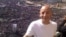 Khaled Fahmy, history professor at the American University in Cairo, stands in front of crowds in Egypt's Tahrir Square.