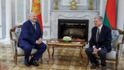 Belarusian President Aleksandr Lukashenko and US envoy John Coale meet in Minsk on December 13.
