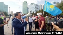 Nurzhan Altaev (with bullhorn) and members of the El Tiregi party rally in Nur-Sultan on September 7.