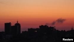 Smoke rises in the sky over the city after a Russian missile strike in Kyiv on August 18.