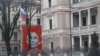A skeletal depiction of Russian President Vladimir Putin on a building facing the Russian Embassy in Riga, Latvia, photographed in January 2023