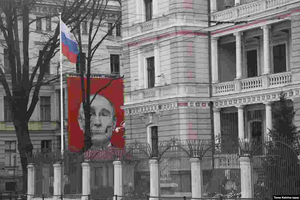 A skeletal depiction of Russian President Vladimir Putin on a building facing the Russian Embassy in Riga, Latvia, photographed in January 2023