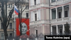 A skeletal depiction of Russian President Vladimir Putin on a building facing the Russian Embassy in Riga, Latvia, photographed in January 2023
