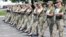 A handout photograph from the Ukrainian Defense Ministry showing female Ukrainian soldiers wearing high heels while taking part in a military parade rehearsal in Kyiv.