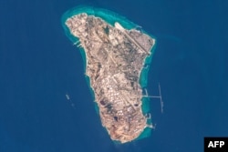 A handout image taken by the European Space Agency shows a view of Iran's Kharg Island, which hosts the country’s main crude export terminal and is responsible for the overwhelming majority of its oil shipments, on March 7.