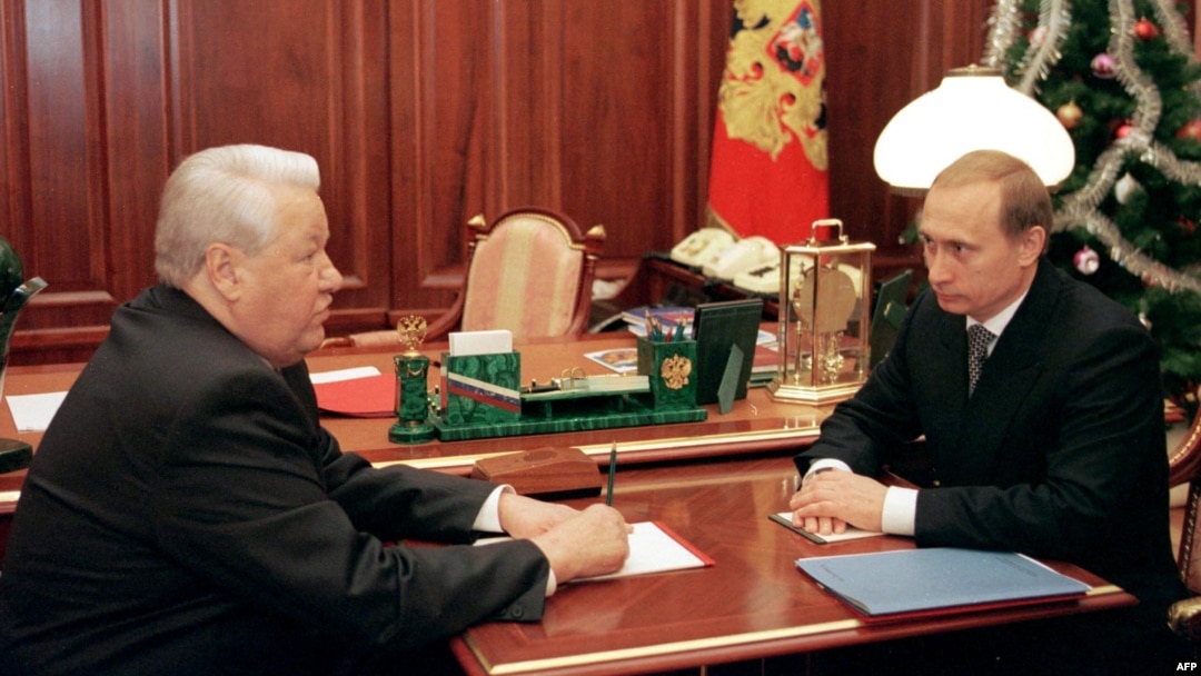 Russia President Boris Yeltsin speaks with then-Prime Minister Vladimir Putin at the Kremlin on December 31, 1999, the day that Yeltsin would resign and appoint the former KGB agent as the country's acting leader.