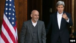 Afghan President Ashraf Ghani and US Secretary of State John Kerry addressing reporters at Camp David, Maryland