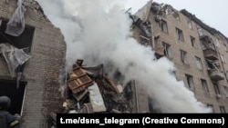 Emergency crews work at the site of the deadly Russian strike in Kryviy Rih on November 11.