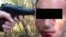 Скриншот размещенного в социальной сети видеоролика, где мужчина, которому угрожают пистолетом, подвергается изнасилованию.