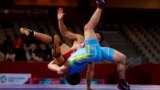 Indonesia-Wrestling - 2018 Asian Games – Men's Greco-Roman 60 kg Bronze Medal Final - JCC – Assembly Hall - Jakarta, Indonesia – August 21, 2018 – Ri Se Ung of North Korea in action with Mirambek Ainagulov of Kazakhstan. REUTERS/Issei Kato