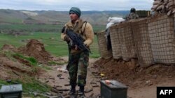 FILE: An Afghan Nation Army (ANA) soldier keeps watch during an operation in Bala Morghab district of Badghis Province.