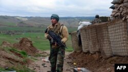 An soldier keeps watch during an operation in Bala Morghab district of the northwestern Badghis Province on March 26.