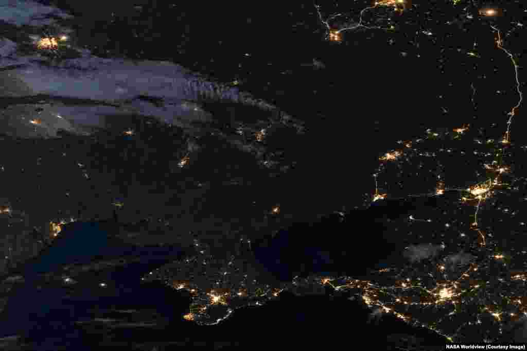 Nighttime views of southeastern Ukraine and western Russia seen on June 14, 2012 and April 27, 2026.Today swathes of Ukraine's once bustling Donbas region are plunged into darkness after sunset due to a combination of wartime power outages and depopulation. The Donbas region has seen millions of its residents flee conflict there since 2014.