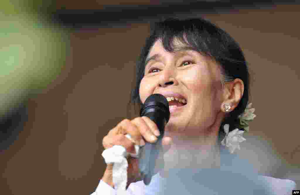 Suu Kyi greets a crowd of supporters at her National League for Democracy (NLD) headquarters in Yangon on April 2, 2012.