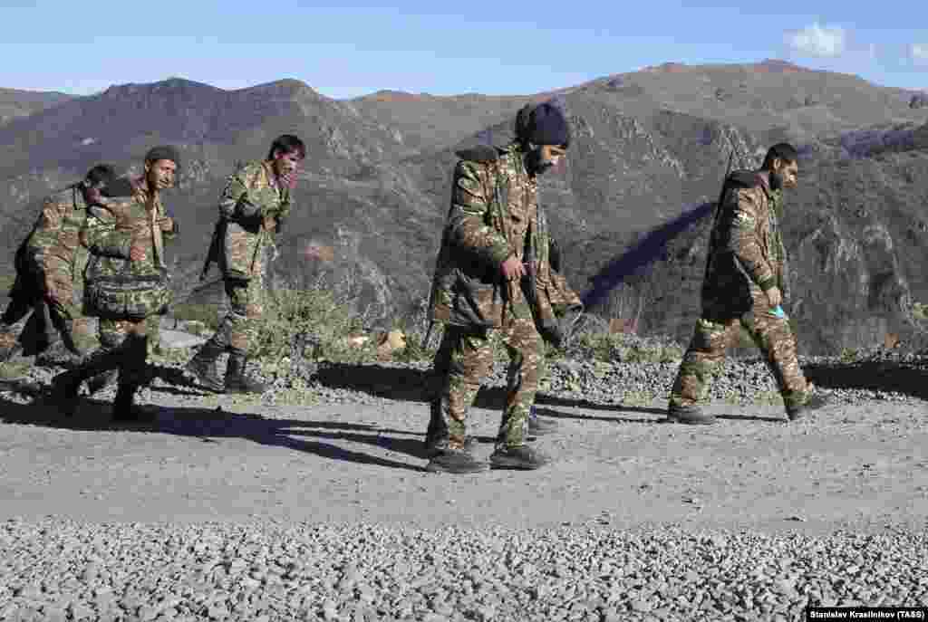 Armenian servicemen in Nagorno-Karabakh walk near the Armenian border on November 8.&nbsp;