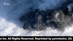 The fire at the premises of the Primorsk port oil depot in Leningrad Oblast continues for the second day, with smoke so thick and dense that it can be seen even through clouds on the high resolution satellite image taken March 24