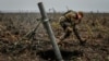 A Ukrainian soldier fires a mortar on the front line in the Zaporizhzhya region on November 16.