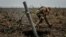 A Ukrainian soldier fires a mortar on the front line in the Zaporizhzhya region on November 16.