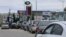 FILE PHOTO: Cars queue for fuel at a gas station in Sevastopol