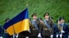 Ukrainian Honor Guard soldiers march during a ceremony for National Flag Day in Kyiv on August 23. 