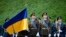 Ukrainian Honor Guard soldiers march during a ceremony for National Flag Day in Kyiv on August 23. 