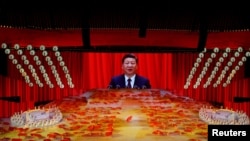 Imaginea președintelui Xi Jinping într-un uriaș spectacol omagial dedicat celebrării a 100 de ani de la înființarea Partidului Comunist Chinez, 28 iunie 2021. REUTERS.