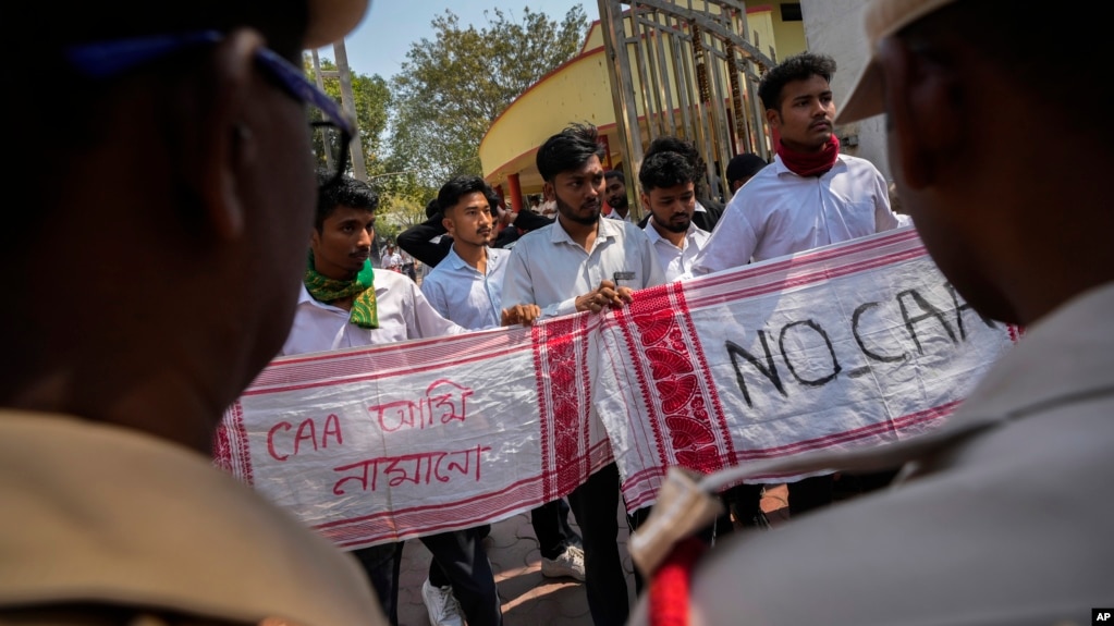 Students protest against the Citizenship Amendment Act in Guwahati, India, on March 12. The new rules implemented by New Delhi on March 11 exclude Muslims, who are the majority in all three countries. 