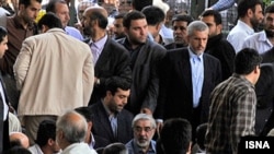 Opposition leader Mir Hossein Musavi (with glasses) has kept his public appearances to a minimum since the unrest began.