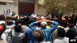 Pakistani protesters gather outside a police station during a demonstration against a Hindu man charged with blasphemy in the town of Hub in the southwestern Balochistan Province in May.