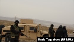 Soldiers man a checkpoint outside the village of Shetpe in December.