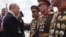 Russian President Vladimir Putin greets North Korean soldiers on Red Square after the Victory Day military parade in central Moscow on May 9, 2025.