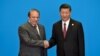 Pakistani Prime Minister Nawaz Sharif (L) shakes hands with Chinese President Xi Jinping during the welcome ceremony for the Belt and Road Forum in May.