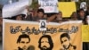 Pakistani human rights activists hold images of some of the bloggers who have gone missing during a protest in Islamabad on January 10.