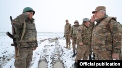 Armenia -- Defense Minister Vagharshak Harutiunian (R) visits a new Armenian army post set up in Syunik province, December 18, 2020.