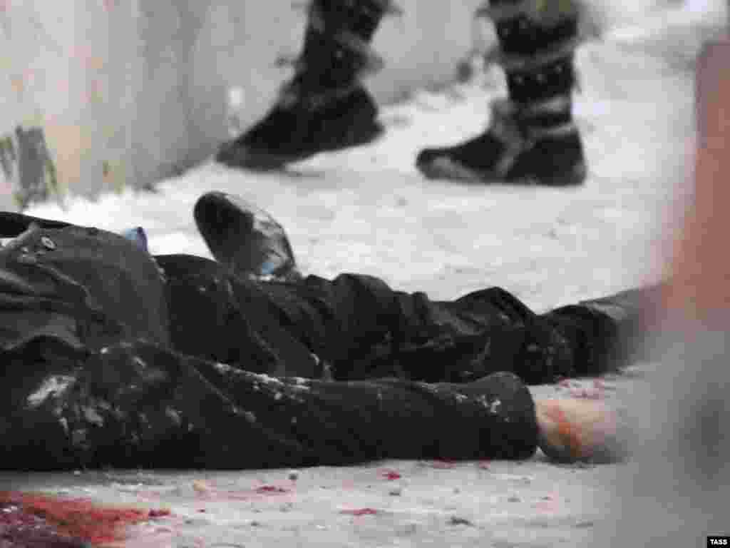 The body of the Russian lawyer Stanislav Markelov, who was representing a Chechen family in court, lies on the ground after he was shot dead in Moscow on January 19. His murder has become a symbol of lawlessness and human rights abuses in Chechnya. 