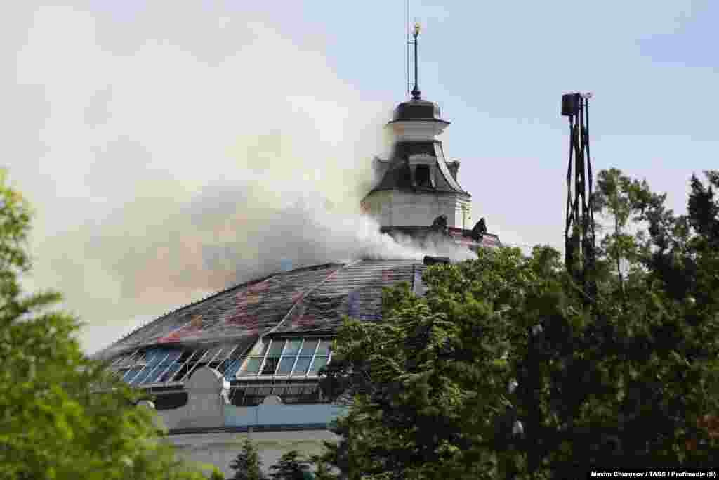 Firefighters at work on the roof of the building that housed the Siege of Sevastopol panorama on June 10.A spokesman for UNESCO voiced “alarm” over reports of the drone strike in an email to RFE/RL, but added that the organization “does not currently have access to the area and could not yet verify the details of the reports.”