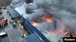 Rescuers work at the site of a shopping mall destroyed during a Russian military attack in Nikopol, Ukraine, on March 6.