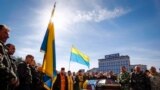 Ukraine -- Kyiv - Clergymen and members of the Maidan self-defence forces stand around the coffin during the funeral of an unidentified activist, who was killed in recent clashes in Kiev, April 5, 2014. REUTERS/Shamil Zhumatov (UKRAINE - Tags: POLITICS C