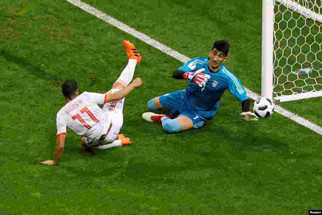 Soccer Football - World Cup - Group B - Iran vs Spain - Kazan Arena, Kazan, Russia - June 20, 2018 Iran's Alireza Beiranvand in action with Spain's Lucas Vazquez REUTERS/John Sibley