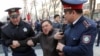 KAZAKHSTAN -- Police officers detain an anti-government protester during a rally in Almaty, Kazakhstan March 22, 2019. 