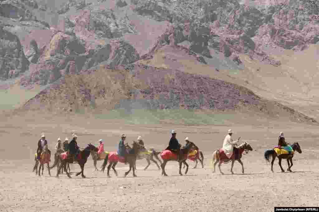 Riders take part in the At Chabysh (Horse Races) festival in Murghob. The festival was created by Kyrgyz Aty, a Bishkek-based organization, in 2009 to help preserve the disappearing traditions of the Kyrgyz nomads. The only regional cultural event in Murghab, the festival has begun to attract international tourists. 