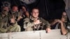 Wagner soldiers sit in their vehicle on a street in Rostov-on-Don on June 24. Relatives of Wagner fighters say they are angry, and worried, about what comes next. 